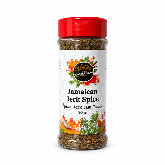 A clear plastic bottle of Jamaican Jerk Spice containing 90g of ground spice, featuring a white label with colorful illustrations and a bright red cap, set against a plain white background.